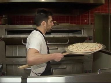 VIDEO: Generous customers at Rosa's Fresh Pizza in Philadelphia buy a slice or two for someone in need.