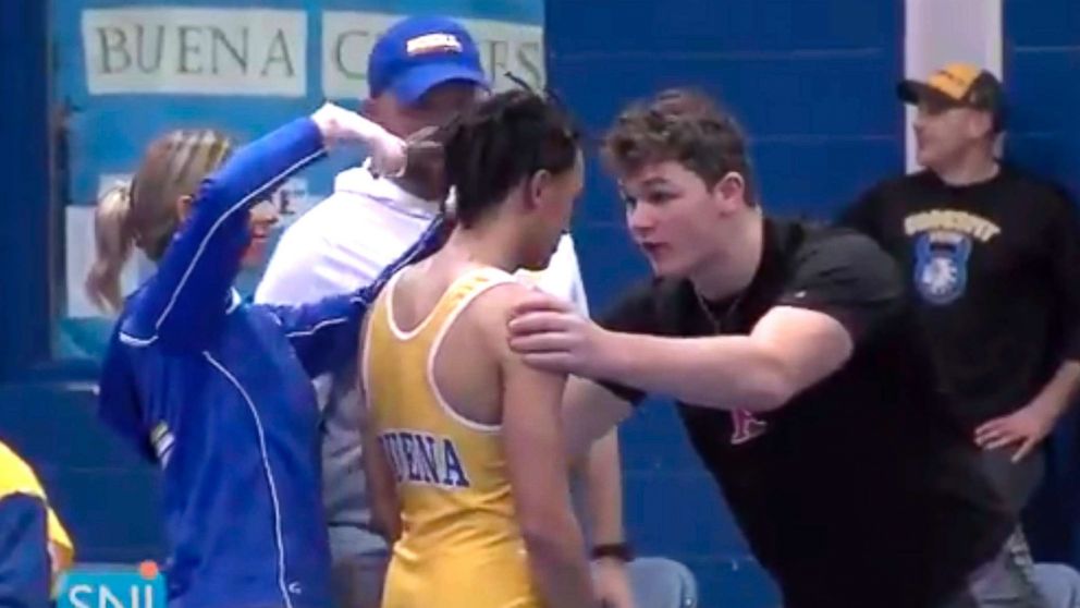 PHOTO: Buena Regional High School wrestler Andrew Johnson gets his hair cut courtside minutes before his match in Buena, N.J., after a referee told Johnson he would forfeit his bout if he didn't have his dreadlocks cut off, Dec. 19, 2018.