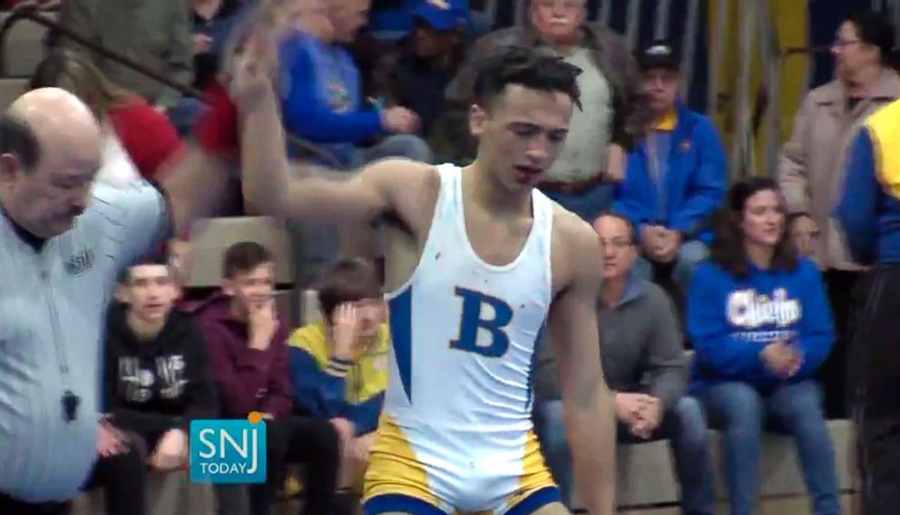 PHOTO: In this image taken from a Wednesday, Dec. 19, 2018, video provided by SNJTODAY.COM, Buena Regional High School wrestler Andrew Johnson is declared the winner after his match in in Buena, N.J.