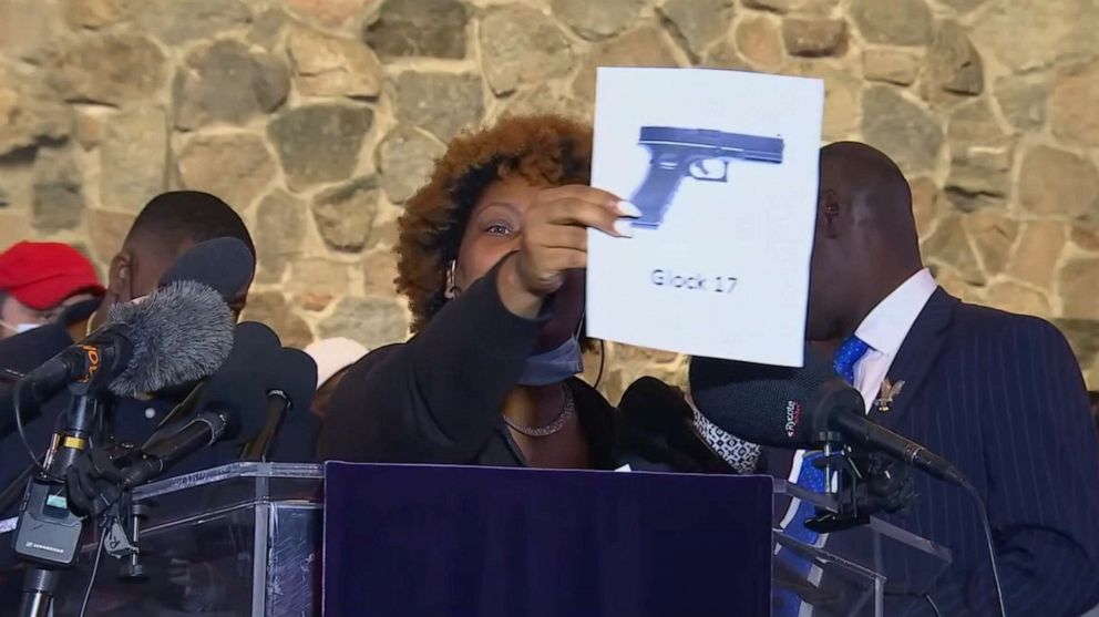 PHOTO: Naisha Wright, holds up a picture of a gun while speaking during press conference about her nephew, Daunte Wright, April 15, 2021, in Minneapolis.