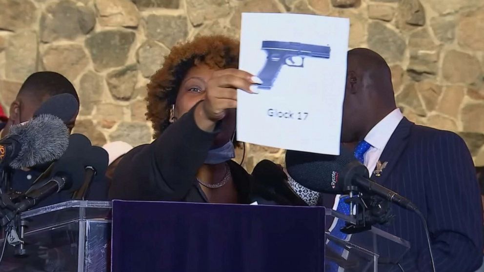 PHOTO: Naisha Wright, holds up a picture of a gun while speaking during press conference about her nephew, Daunte Wright, April 15, 2021, in Minneapolis.