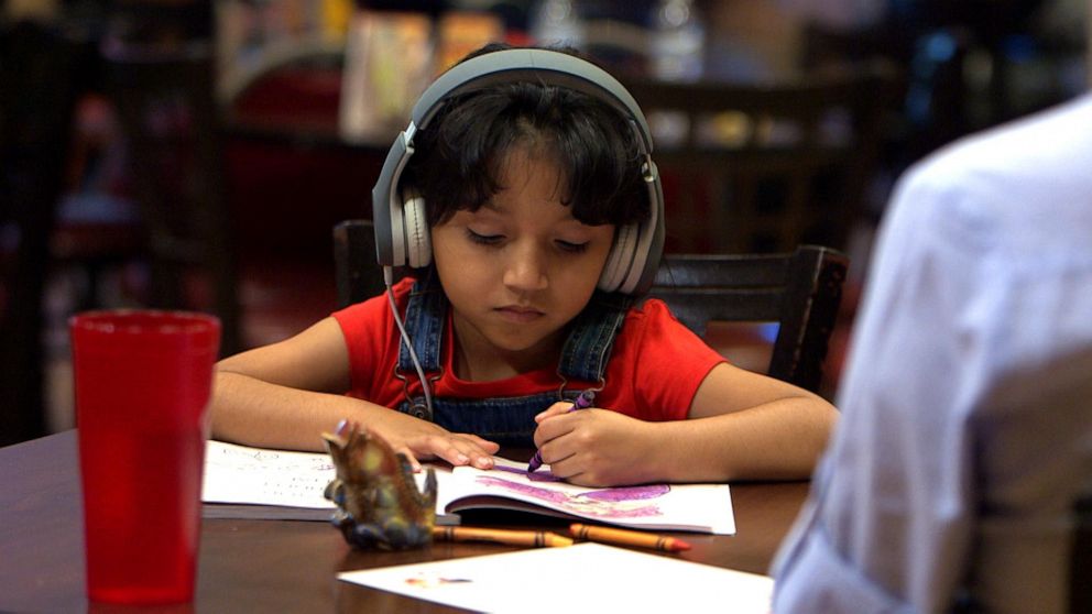 PHOTO: This young girl, played by a child actor, is out to lunch with her loving sponsor while awaiting an immigration hearing when a nearby diner expresses anger that the child is “here illegally.”