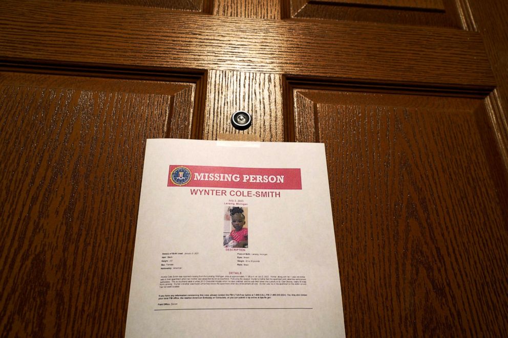 PHOTO: In this July 5, 2023, file photo, signs are seen posted on doors in the building outside of an apartment where Rashad Trice, 26, is accused of kidnapping Wynter Cole Smith, 2, on Sunday night at her home in Lansing, Mich.