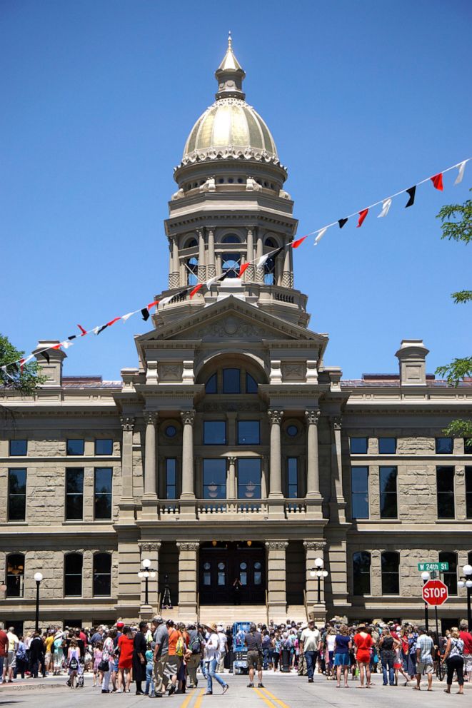 PHOTO: A crowd gathers in front of the Wyoming Capitol in Cheyenne, Wyo., July 10, 2019.