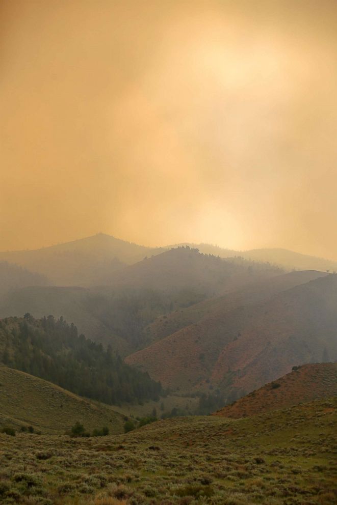 PHOTO: Smoke from the Badger Creek Fire drifts through the air, June 11, 2018, as seen from Highway 10, near Woods Landing, Wyo.