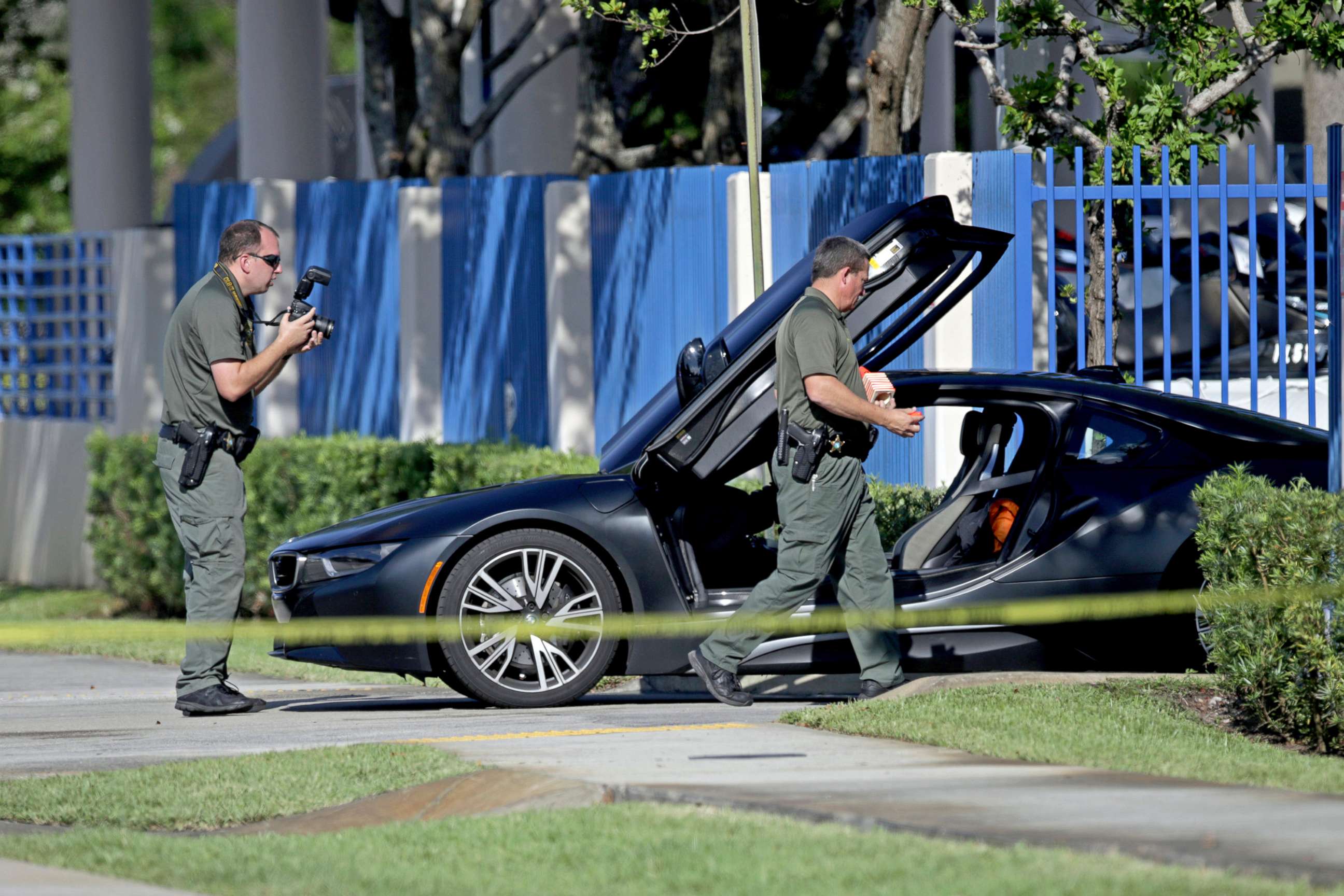 PHOTO: Investigators surround a vehicle after rapper XXXTentacion was shot, June 18, 2018, in Deerfield Beach, Fla.