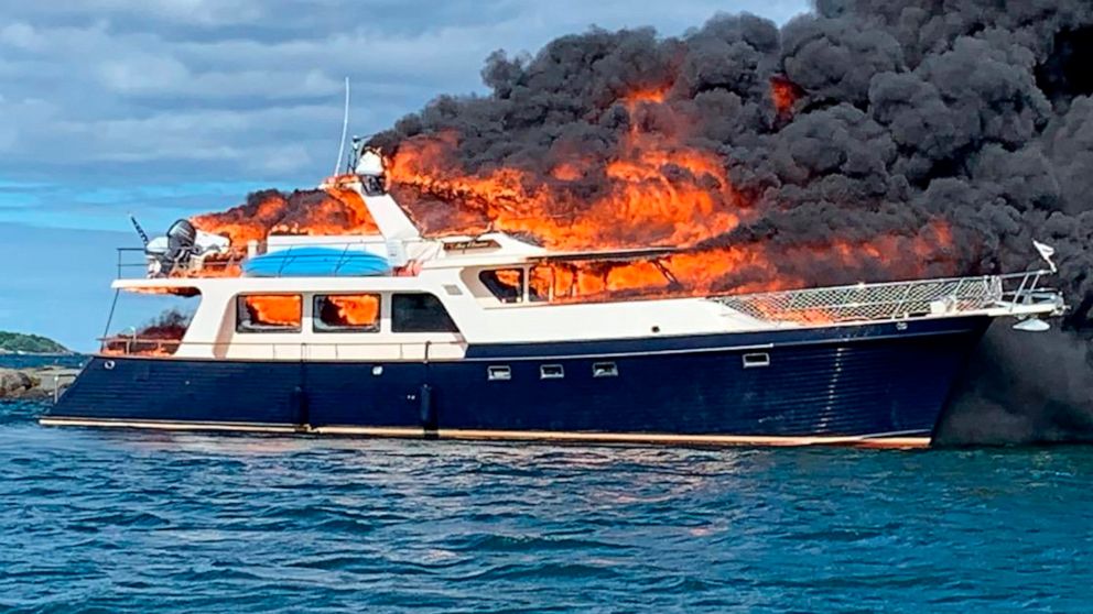 PHOTO: This image provided by New Hampshire State Police shows a yacht burning on the Piscataqua River in New Castle, N.H., on June 18, 2022.