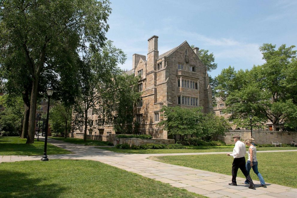 PHOTO: Pedestrians walk down a path on the Yale University campus in New Haven, Connecticut, June 12, 2015.