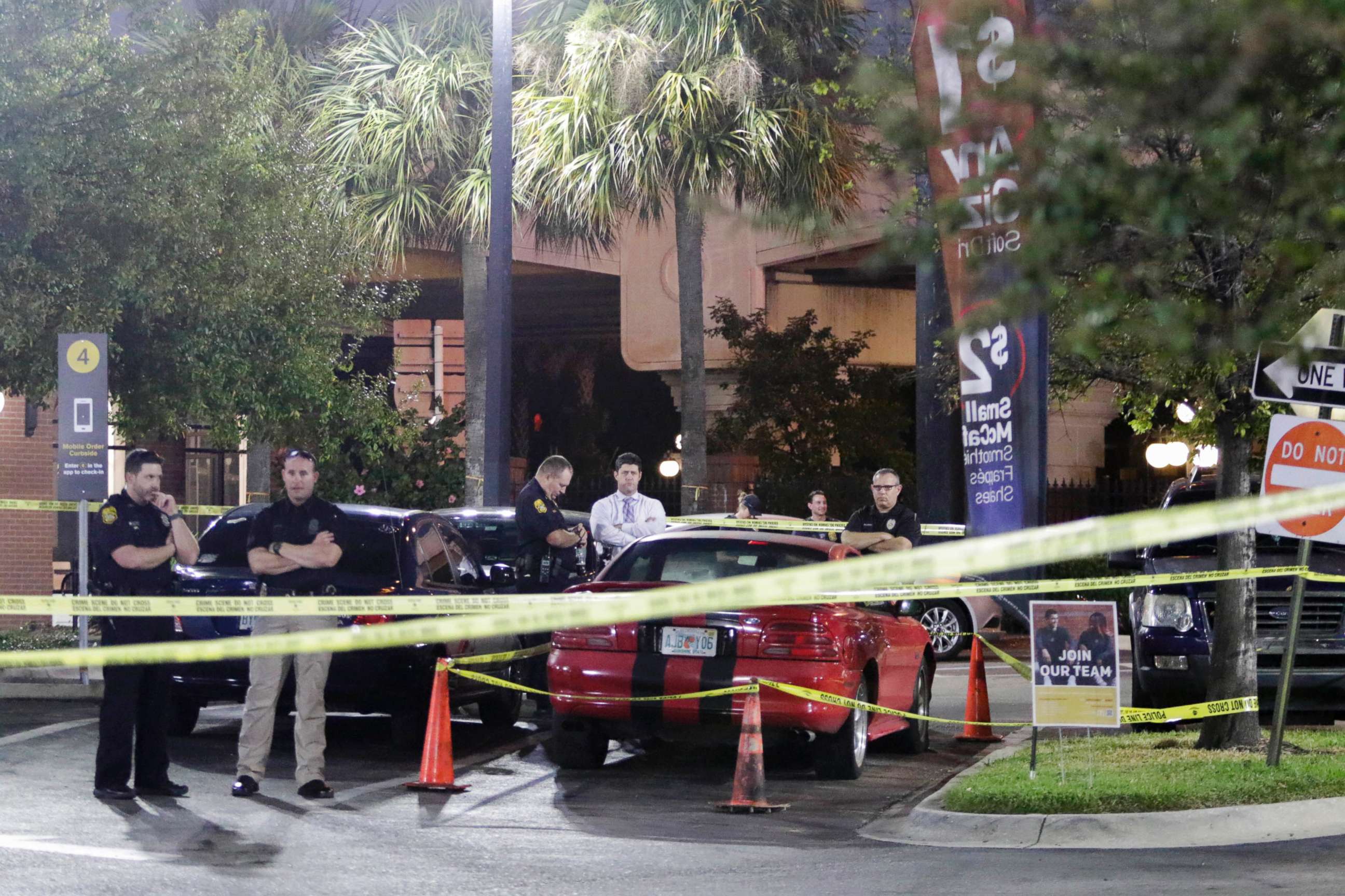 PHOTO: Officers are processing possible evidence and a red sports car at a McDonalds in Ybor City in Tampa, Fla, Nov. 28, 2017. 