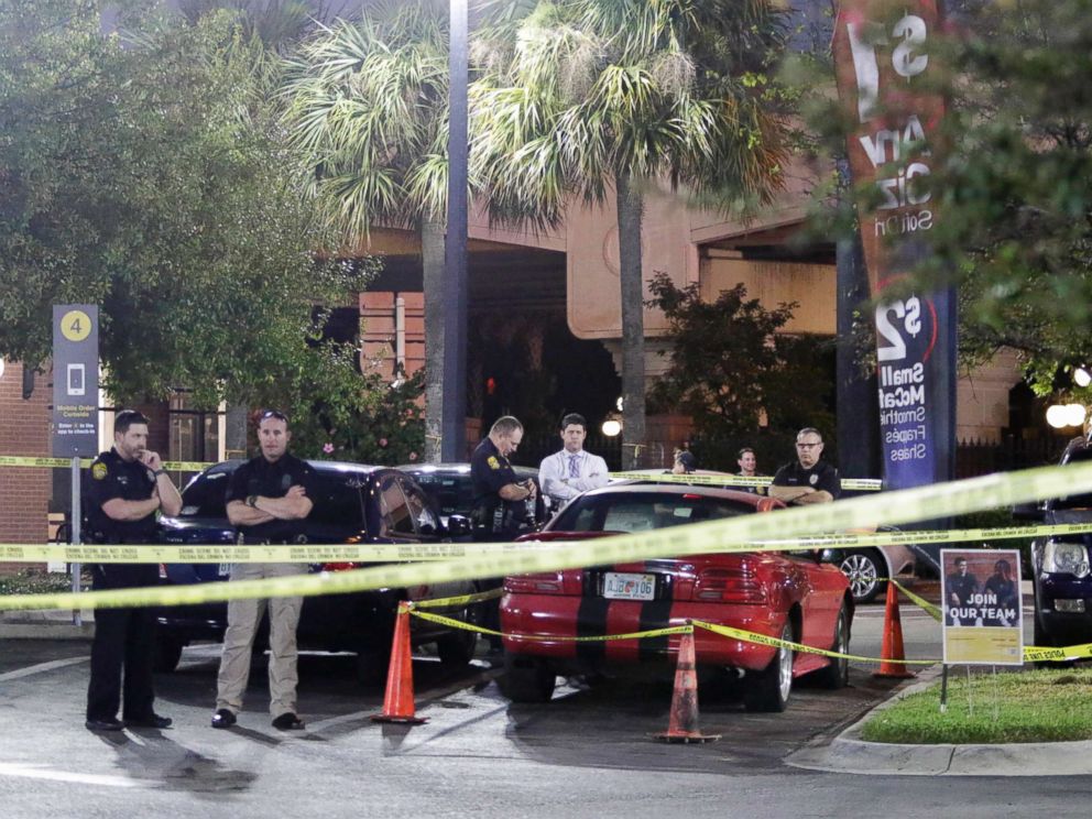 PHOTO: Officers are processing possible evidence and a red sports car at a McDonalds in Ybor City in Tampa, Fla, Nov. 28, 2017.