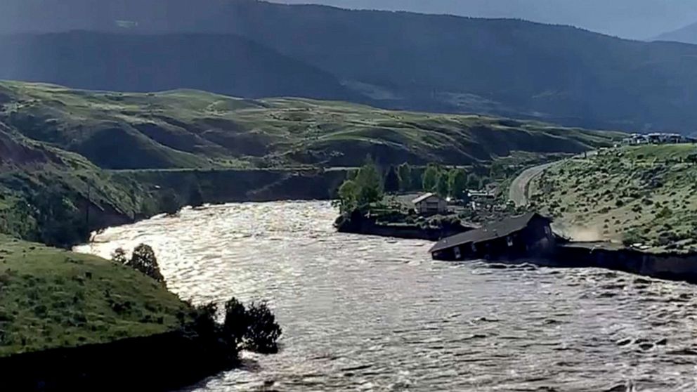 PHOTO: A house falls into the Yellowstone river due to flooding in Gardiner, Mont., June 13, 2022 in this screen grab obtained from a social media video.