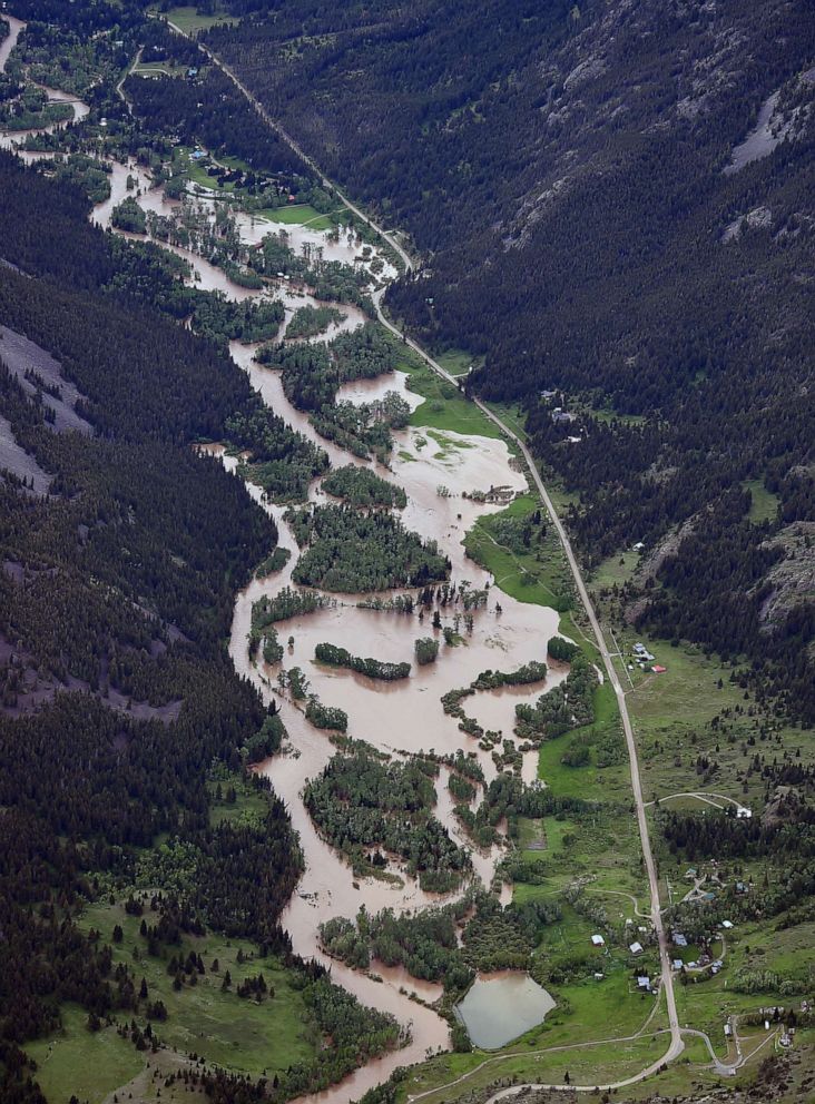 PHOTO: The Boulder River south of Big Timber floods roads and homes, June 13, 2022, as major flooding swept away at least one bridge, washed away roads and set off mudslides in Yellowstone National Park in Montana. 