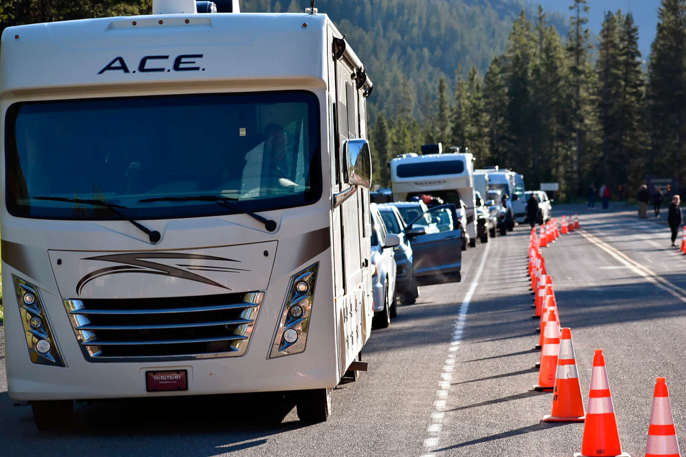 PHOTO: Dozens of vehicles lined up outside Yellowstone National Park's entrance, June 22, 2022, near Wapiti Wyo. The park is partially reopening after being forced to close last week when record flooding caused widespread damage.