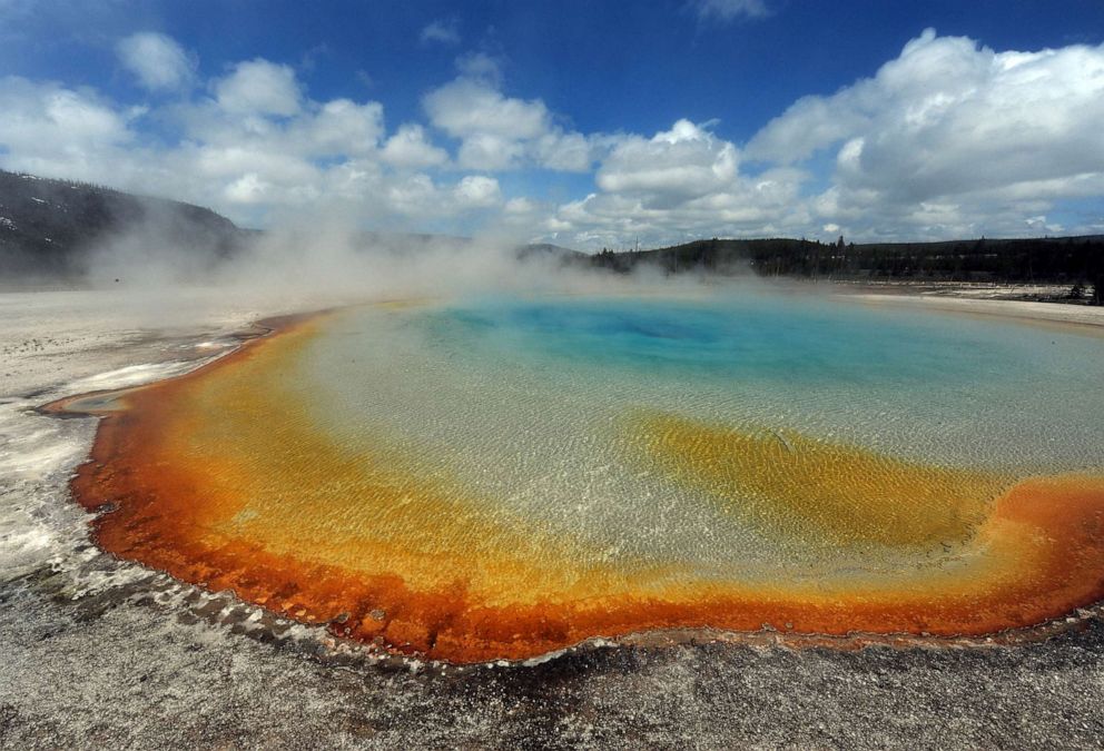 PHOTO: FILE - View of the 'Sunset Lake' hot spring with it's unique colors caused by brown, orange and yellow algae-like bacteria called Thermophiles, that thrive in the cooling water turning the vivid aqua-blues to a murkier greenish brown