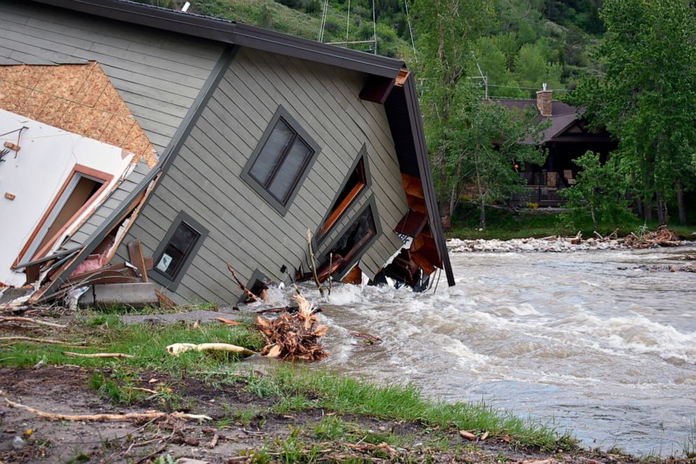 PHOTO: A house that was pulled into Rock Creek in Red Lodge, Mont., by raging floodwaters is seen June 14, 2022.