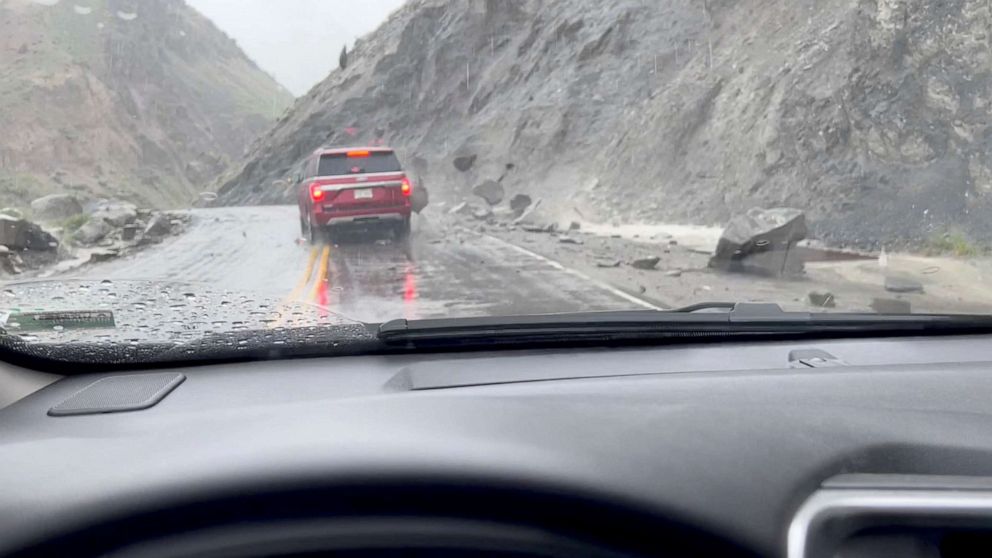 PHOTO: A view shows rocks sliding down the side of a hill and hitting a car at the North Entrance of Yellowstone National Park in Gardiner, Mont., June 12, 2022.