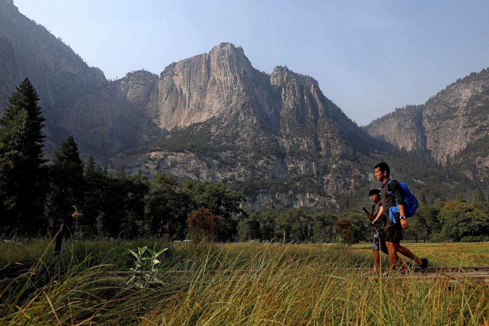 PHOTO: Guests make their way past Columbia Rock in Cook's Meadow as Yosemite Valley reopens in Yosemite, Calif., on Aug. 14, 2018.