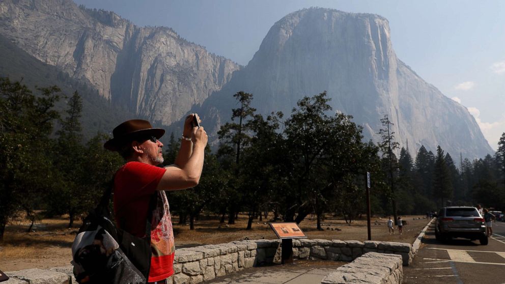 PHOTO: YOSEMITE VALLEY CA AUGUST 14, 2018 -- Steve Maddison takes pictures near El Capitan in the Yosemite Valley, Aug. 14, 2018, after it reopened since being closed due to the Ferguson fire.