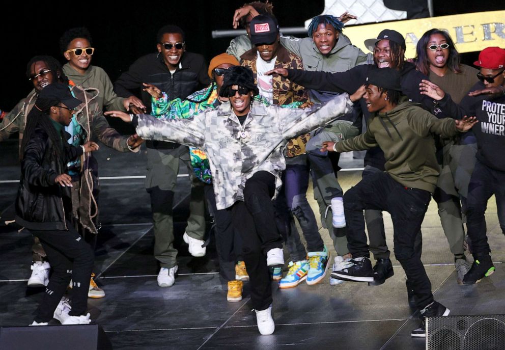 PHOTO: 901 Entertainment Dancers jook on stage during a celebration of life tribute for late rapper Young Dolph at FedExForum on Dec. 16, 2021 in Memphis, Tenn.
