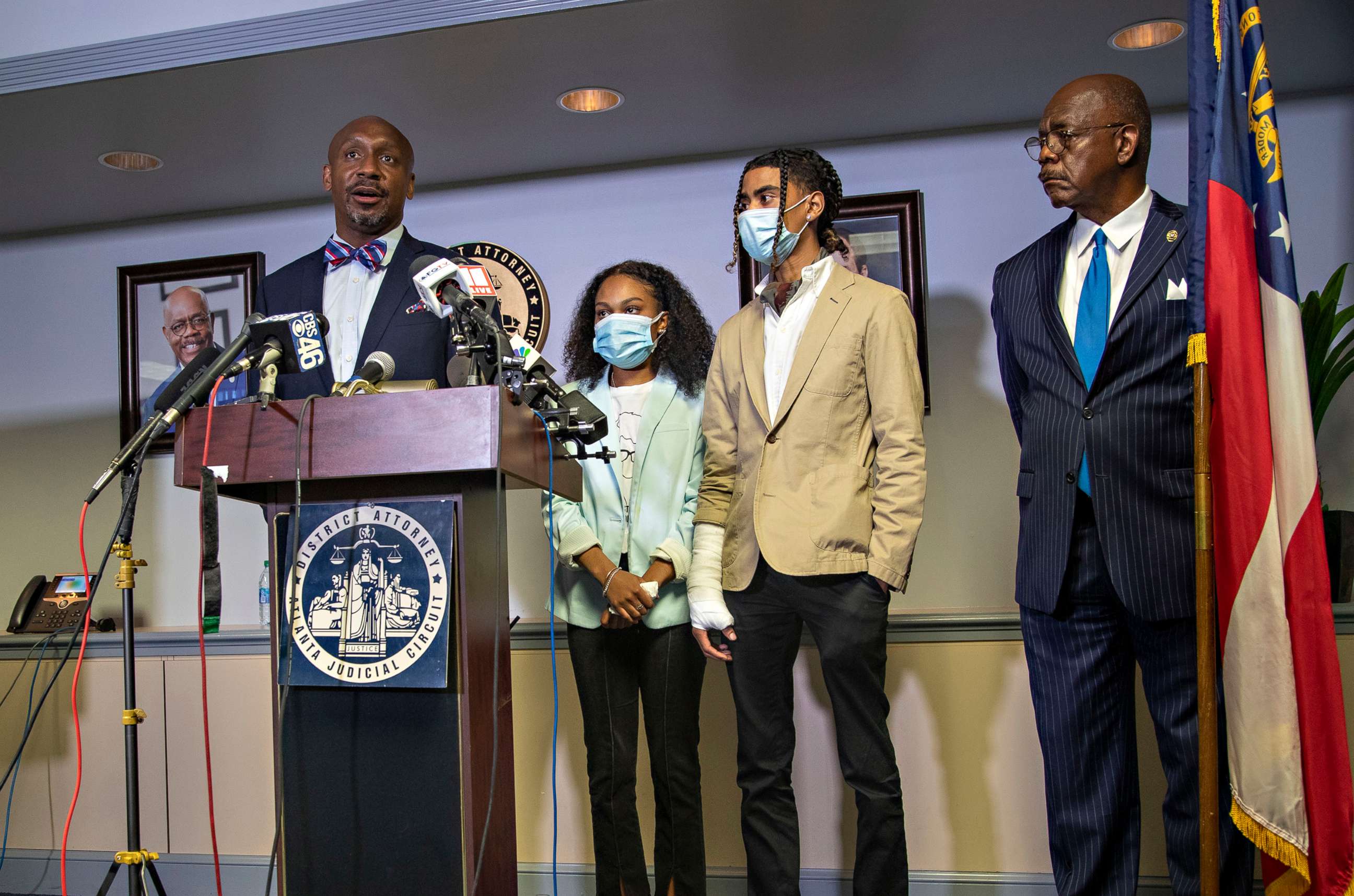 PHOTO: Attorney Mawuli Davis, left, speaks on behalf of Taniyah Pilgrim, center, and Messiah Young, right, during a press conference by the Fulton County District Attorney's Office in Atlanta, June 2, 2020.