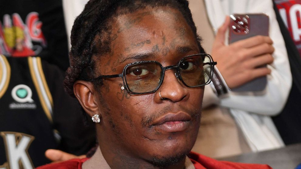 PHOTO: In this Feb. 3, 2022, file photo, rapper Young Thug attends a game between the Phoenix Suns and the Atlanta Hawks, in Atlanta.