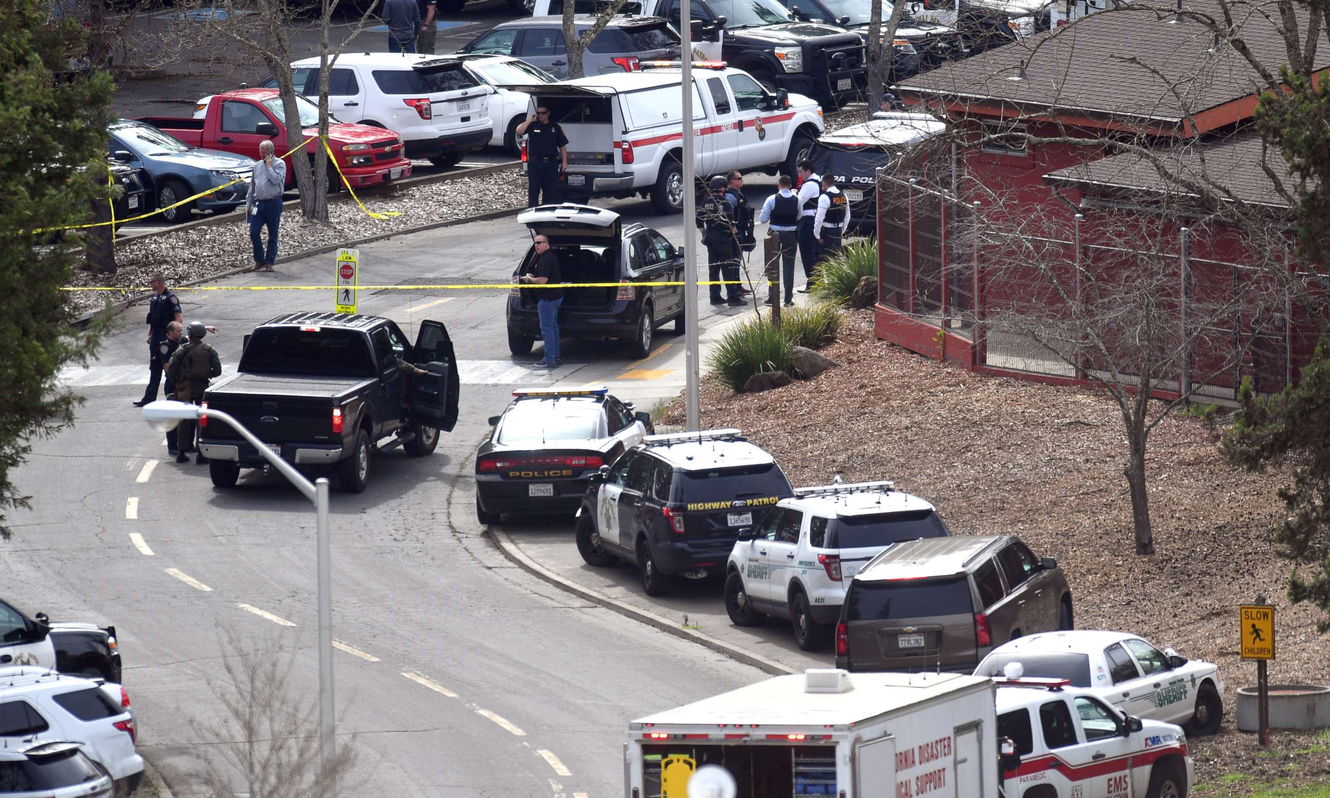 PHOTO: Law enforcement personnel gather near the scene where an active shooter has taken hostages at the Veteran Administration Hospital in Yountville, Calif., March 9, 2018.