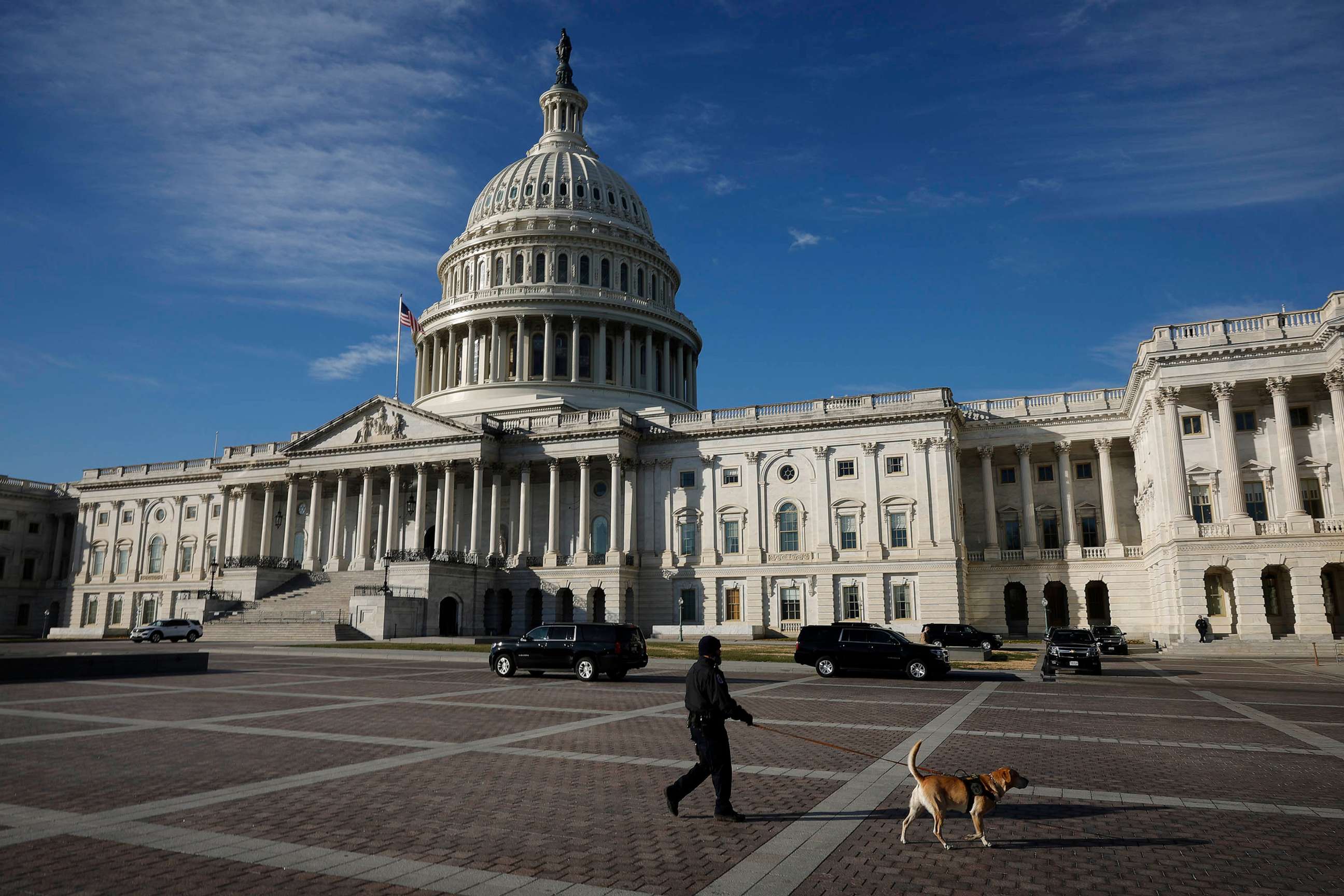 PHOTO: A U.S. Capitol Police officer and K9 patrol the East Front of the U.S. Capitol, Dec. 21, 2022 in Washington, DC.