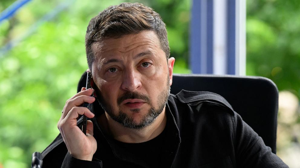 PHOTO: Ukraine's President Volodymyr Zelenskiy speaks on the phone, during a meeting at the 6th European Political Community summit, in Tirana, Albania, May 16, 2025.