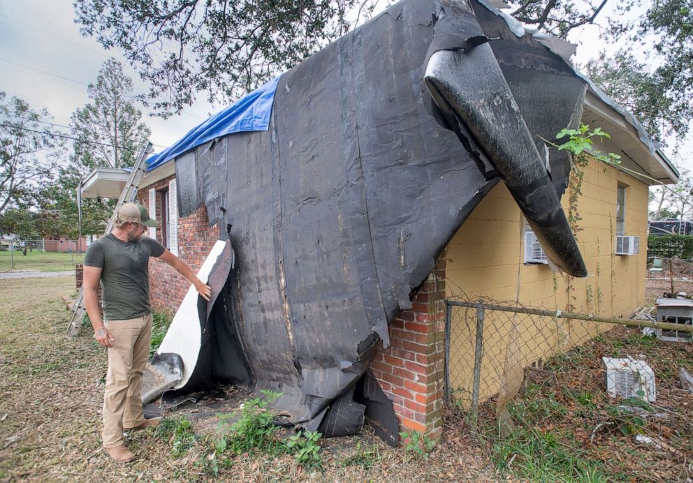 PHOTO: Benjamin Elkins shows the damage to his roof at his West Detroit Boulevard home caused by Hurricane Zeta, in the Ensley area of Pensacola, Fla. Oct. 27, 2020. 