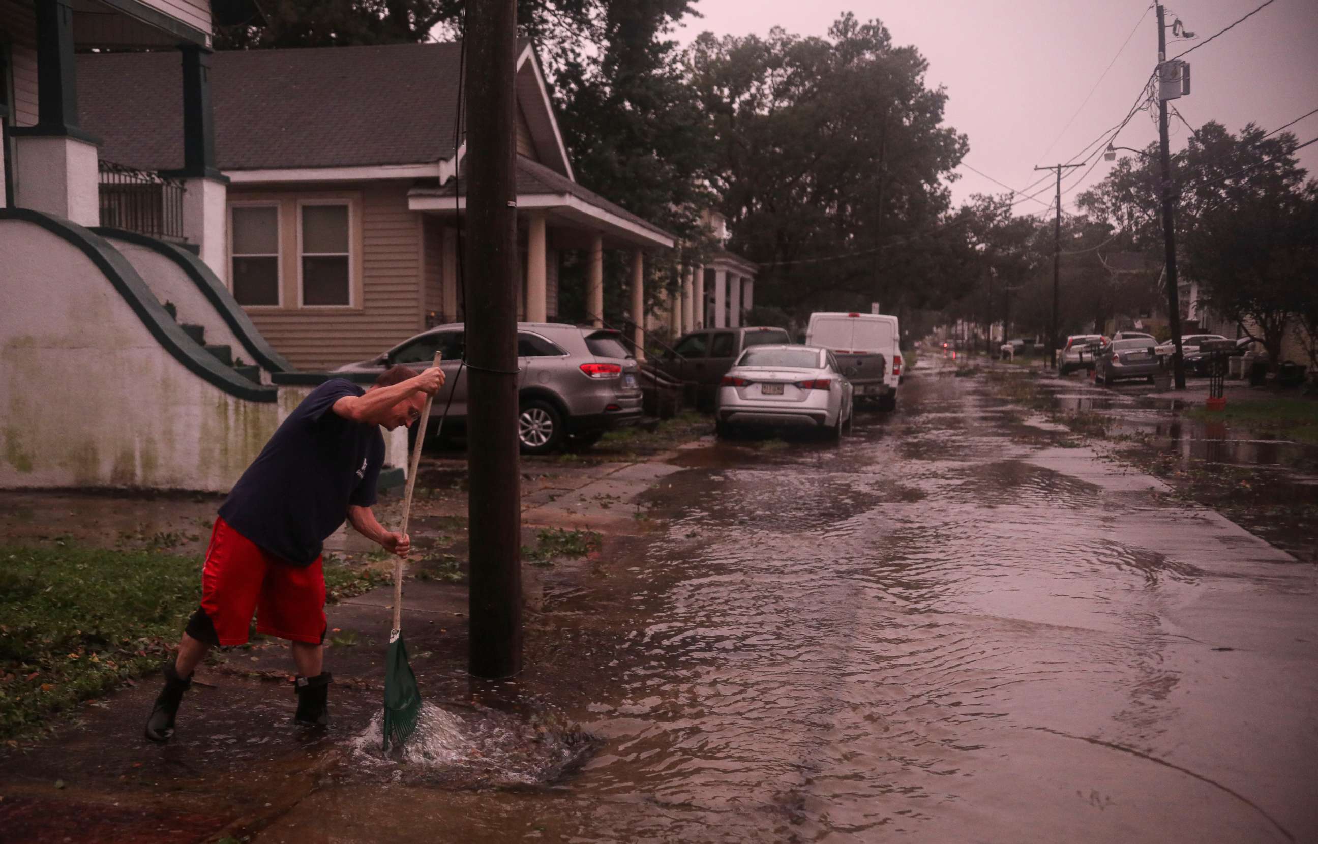 PHOTO: A resident clears storm drains after the eye of Hurricane Zeta passes over on Oct. 28, 2020, in Arabi, La. A record seven hurricanes have hit the Gulf Coast in 2020, bringing prolonged destruction to the area.
