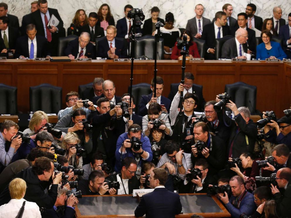 Facebook CEO Mark Zuckerberg is surrounded by members of the media during his appearance before a Senate Judiciary and Commerce Committees joint hearing on Capitol Hill in Washington, April 10, 2018.