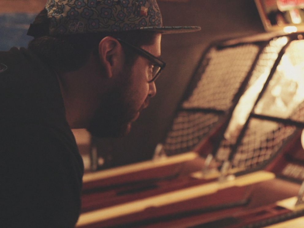 PHOTO: Skee-Ball champion Roy Brewbacca Hinojosa playing at the Full Circle Bar, Austin, Texas.
