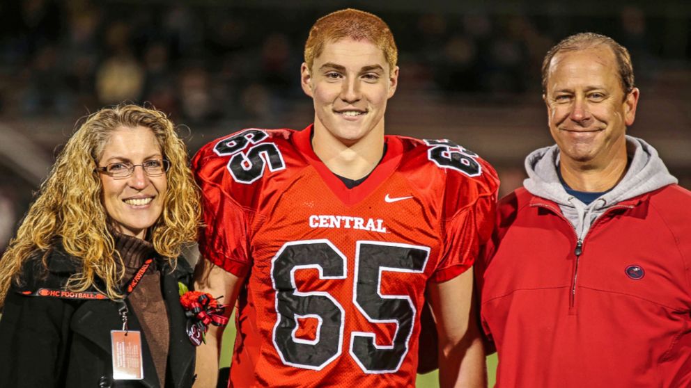 PHOTO: This Oct. 31, 2014, photo provided by Patrick Carns shows Timothy Piazza, center, with his parents Evelyn Piazza and James Piazza, during Hunterdon Central Regional High School football's "Senior Night," in Flemington, N.J. 