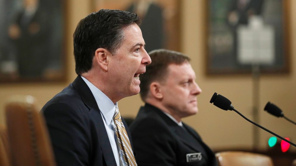 FBI Director James Comey, left, accompanied by National Security Agency Director Michael Rogers testifies on Capitol Hill in Washington, March 20, 2017, before the House Intelligence hearing on allegations of Russian interference in the 2016 U.S. presidential election.