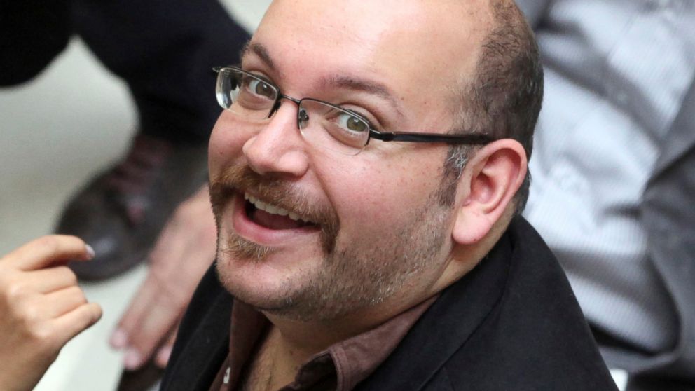 In this photo April 11, 2013 file photo, Jason Rezaian, an Iranian-American correspondent for the Washington Post, attends a presidential campaign of President Hassan Rouhani in Tehran, Iran. 
