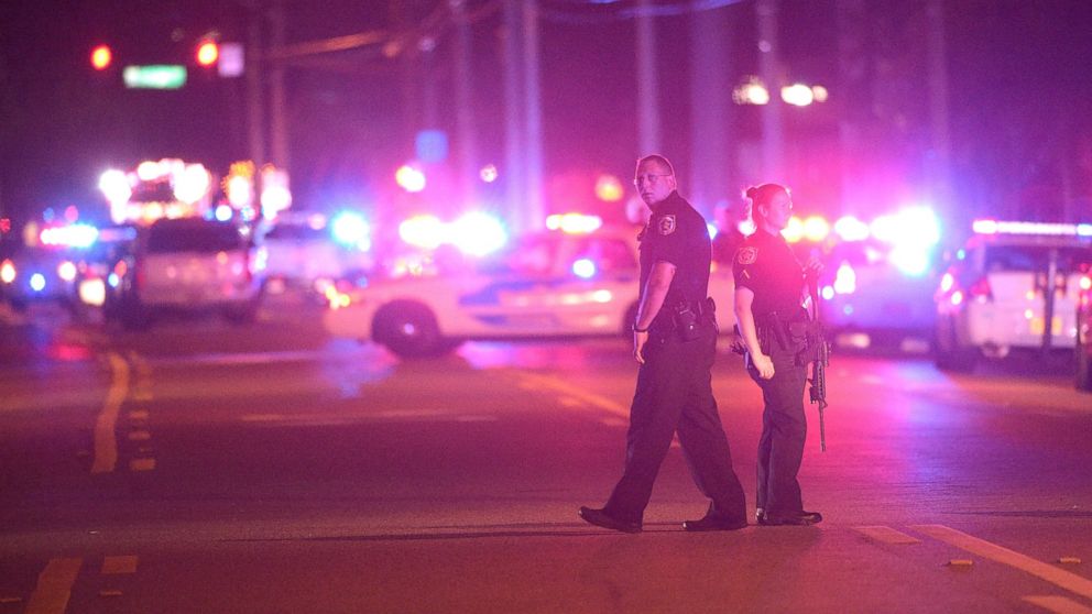 PHOTO: Police officers stand guard down the street from the scene of a shooting involving multiple fatalities at a nightclub in Orlando, Fla., June 12, 2016.