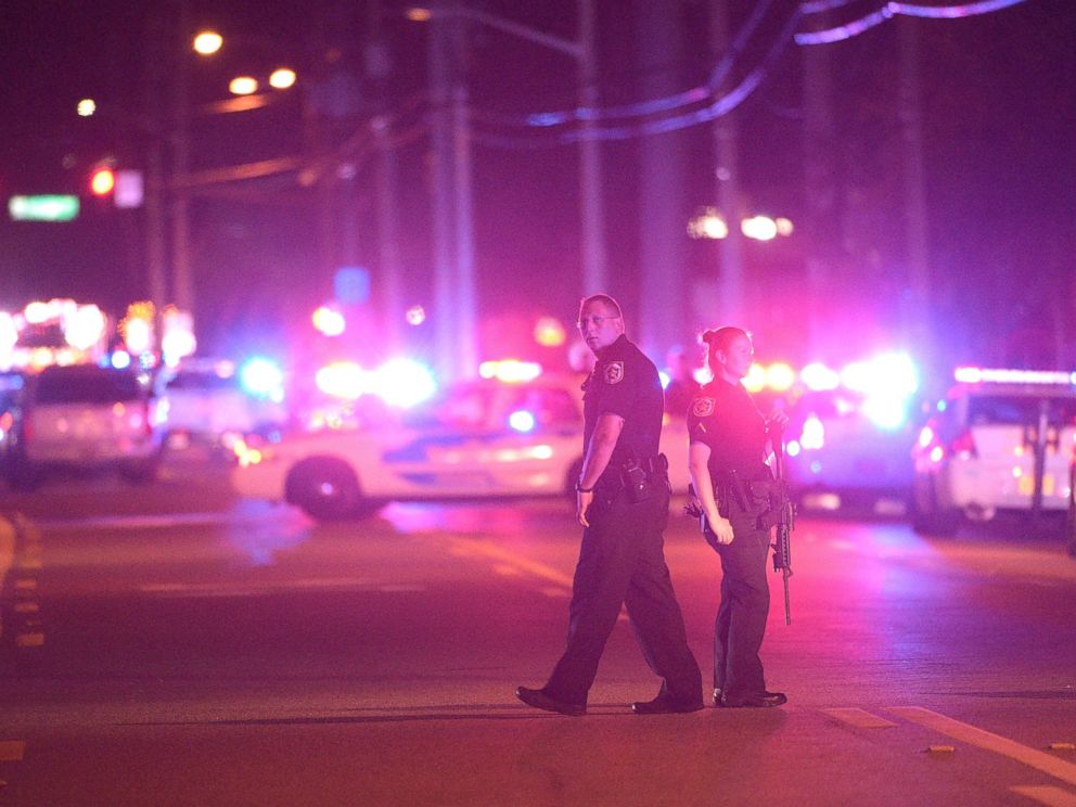 PHOTO: Police officers stand guard down the street from the scene of a shooting involving multiple fatalities at a nightclub in Orlando, Fla., June 12, 2016.