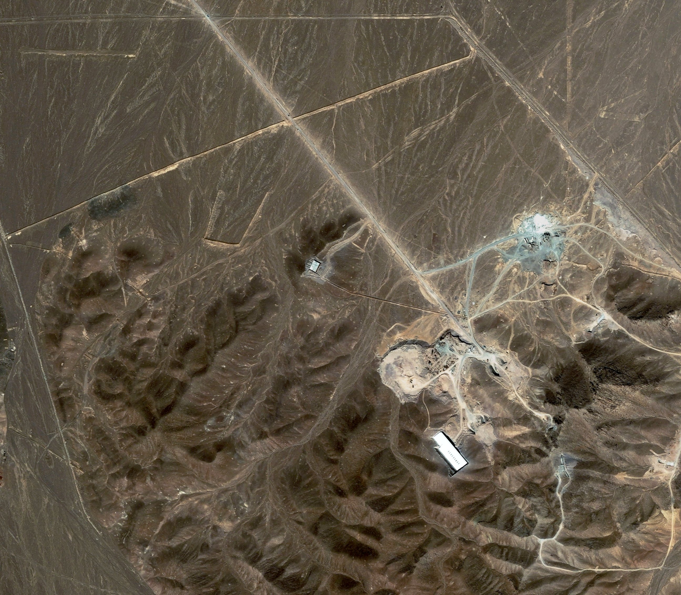 PHOTO: A file satellite image taken Sept. 27, 2009, provided by DigitalGlobe, shows a suspected nuclear enrichment facility under construction inside a mountain located north of Qom, Iran.