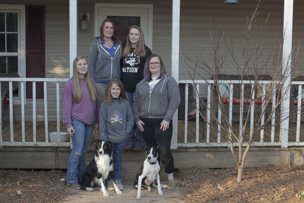 PHOTO: Rebecca Gibson trains dogs at her home in Stanfield, North Carolina, with the help of her four daughters.