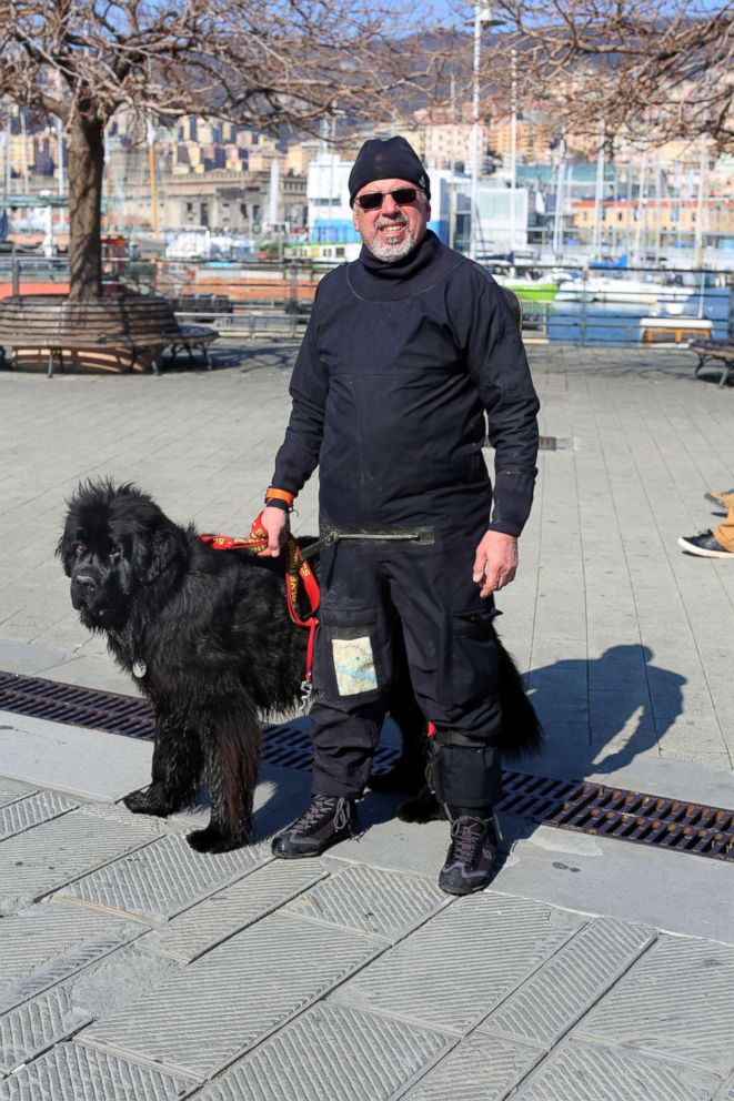 PHOTO: Ferruccio Pilenga stands with his water rescue dog, Reef, a Newfoundland, in Genoa, Italy. 