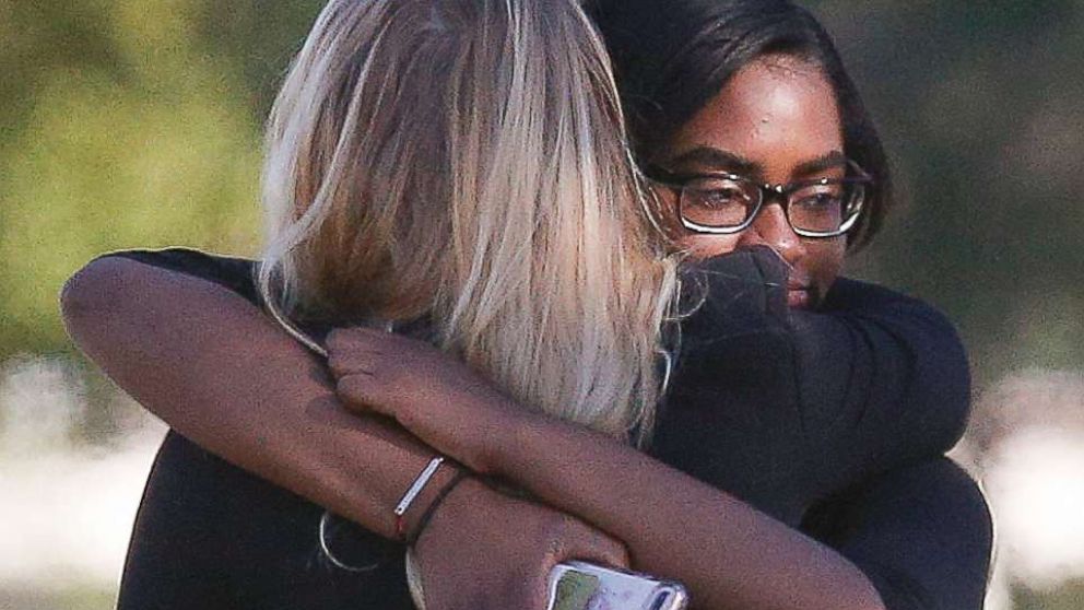 PHOTO: Two people embrace as they arrive before a funeral service for Alyssa Alhadeff at the Star of David Funeral Chapel in North Lauderdale, Fla., Feb. 16, 2018. 