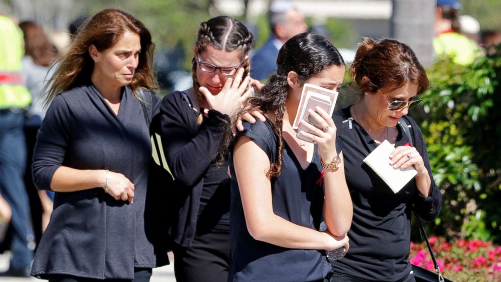 Mourners leave the funeral for Alyssa Aldaheff, 14, one of the victims of the school shooting, in North Fort Lauderdale, Fla., Feb. 16, 2018. 