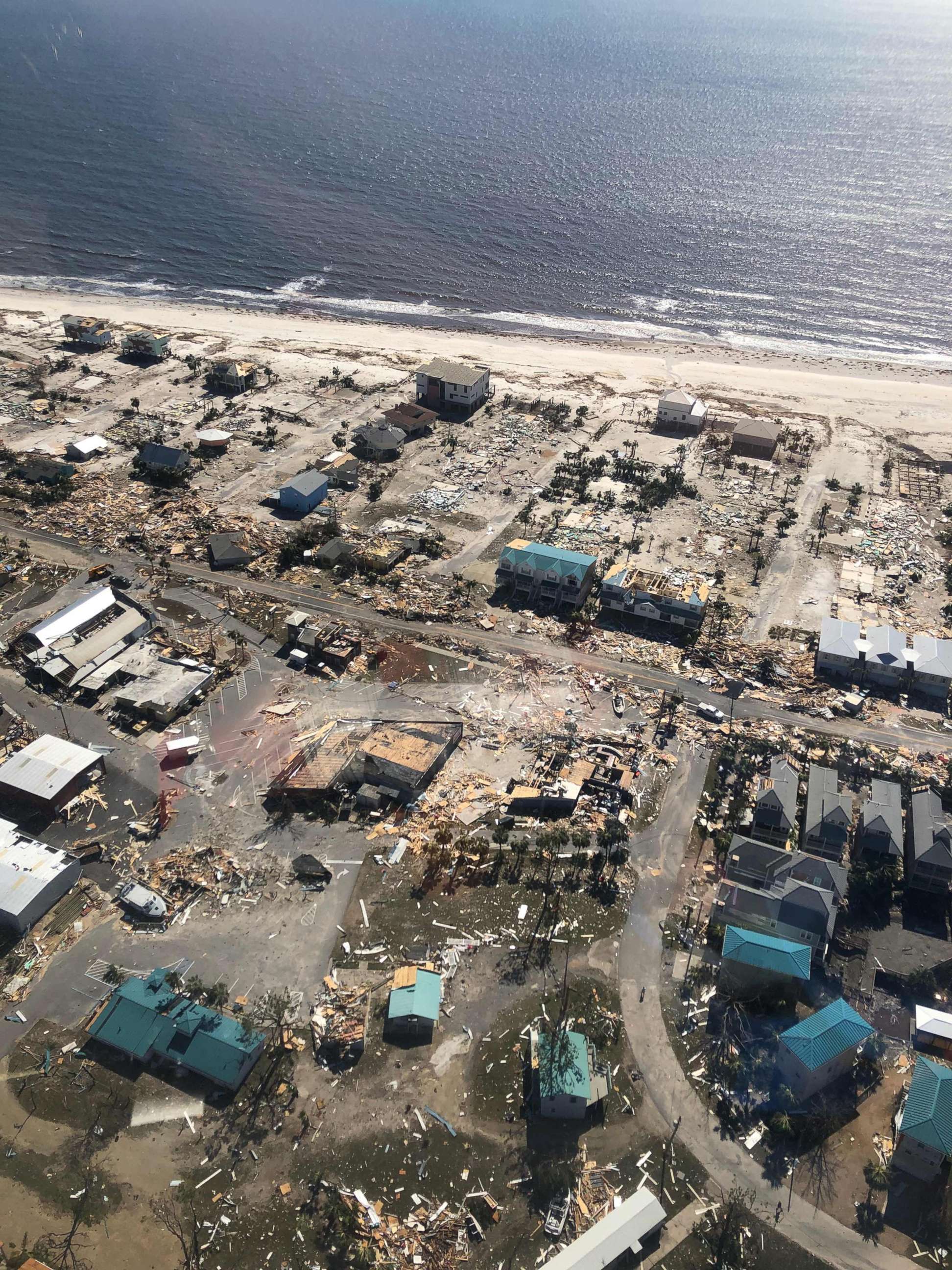 PHOTO: A U.S. Customs and Border Protection helicopter surveys the damage wrought by Hurricane Michael over Mexico Beach, Fla., on Oct. 11, 2018.