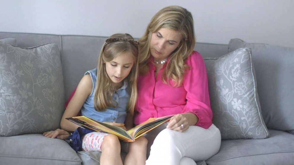 PHOTO: Lily Susan LiCausi, 8, reads a book to her mother Kay LiCausi, who decided to have Lily as a single mother.