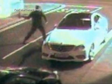 VIDEO: A thief attempts to break into a car with a brick, but ends up knocked out cold.