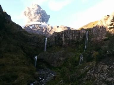 VIDEO: Teams Shovel Ash From Sagging Roofs After Volcano Eruption in Chile