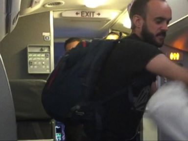 VIDEO: Air Rage Alert: Unruly Passenger Accused of Throwing Punches