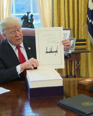 VIDEO: Trump signs the new tax bill into law