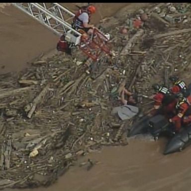 Emergency crews used a ladder and boat to rescue the man.