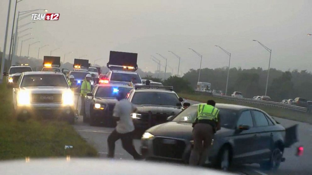 The officer is in critical condition, police said, after he was hit while standing on the side of an interstate in Florida.    